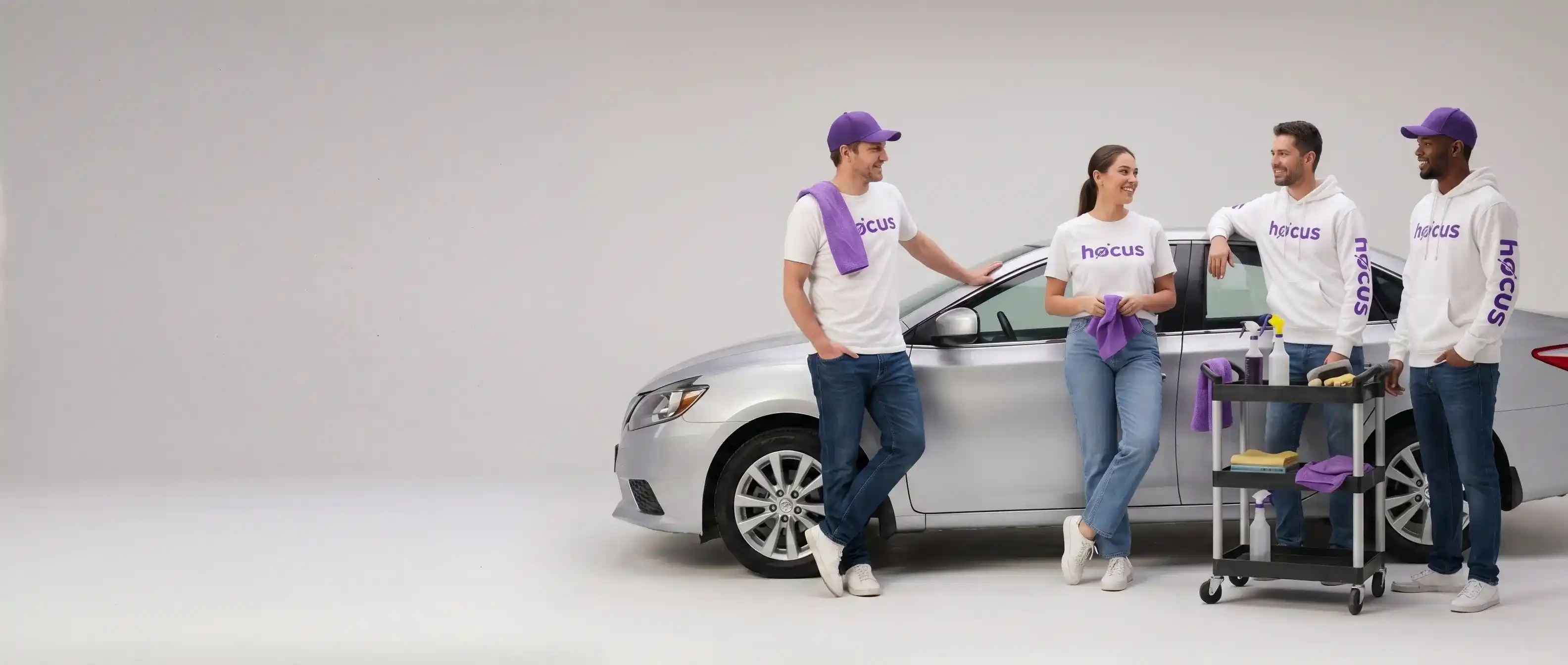 Hocus team standing together next to a vehicle
